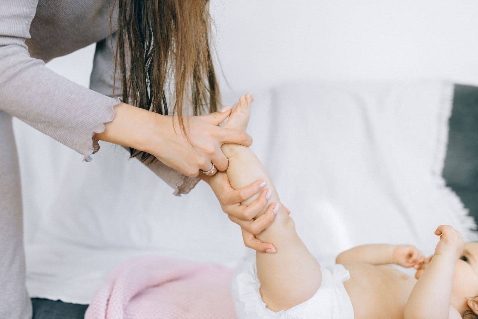 A mother giving her baby a gentle massage at home